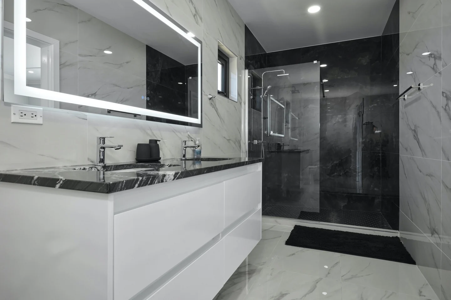Veined stone double vanity and illuminated mirror at Canto di Lama 44