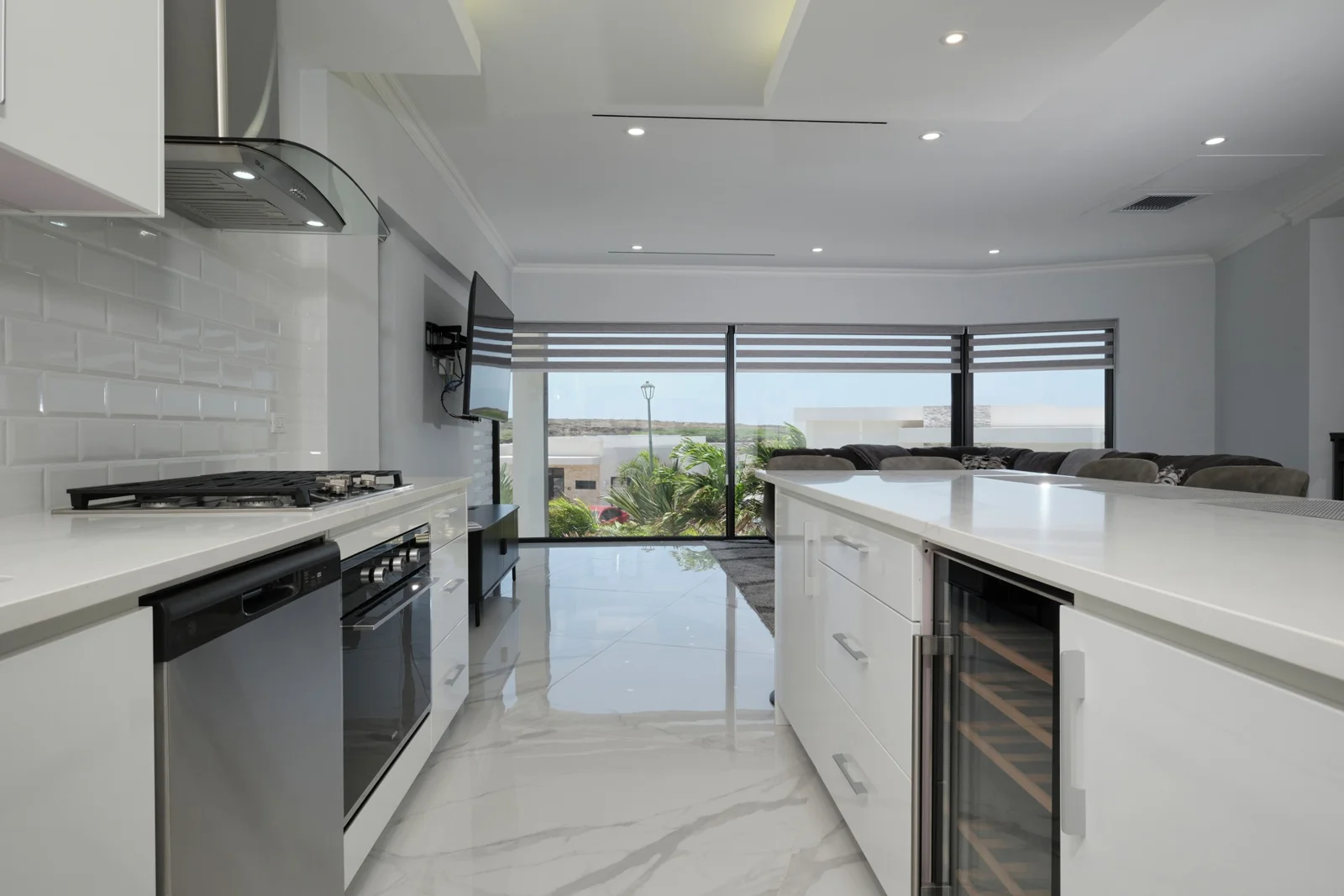 Monochrome kitchen with stone island in the featured villa